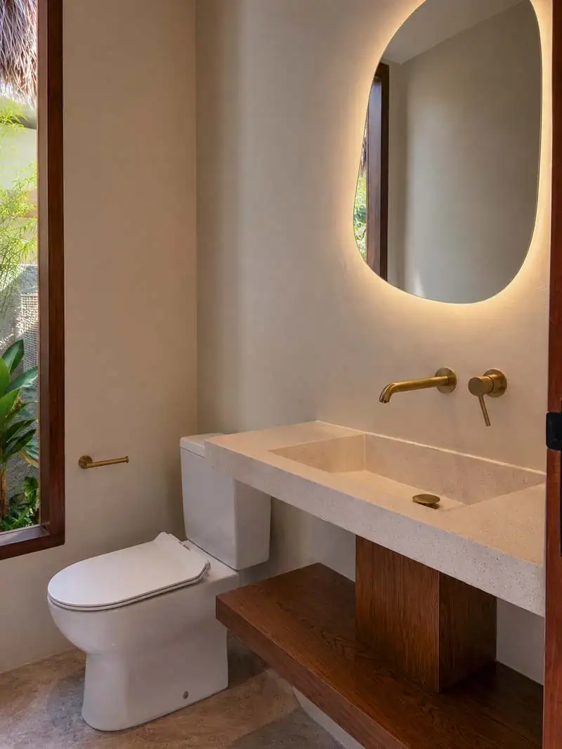Guest bathroom with backlit mirror